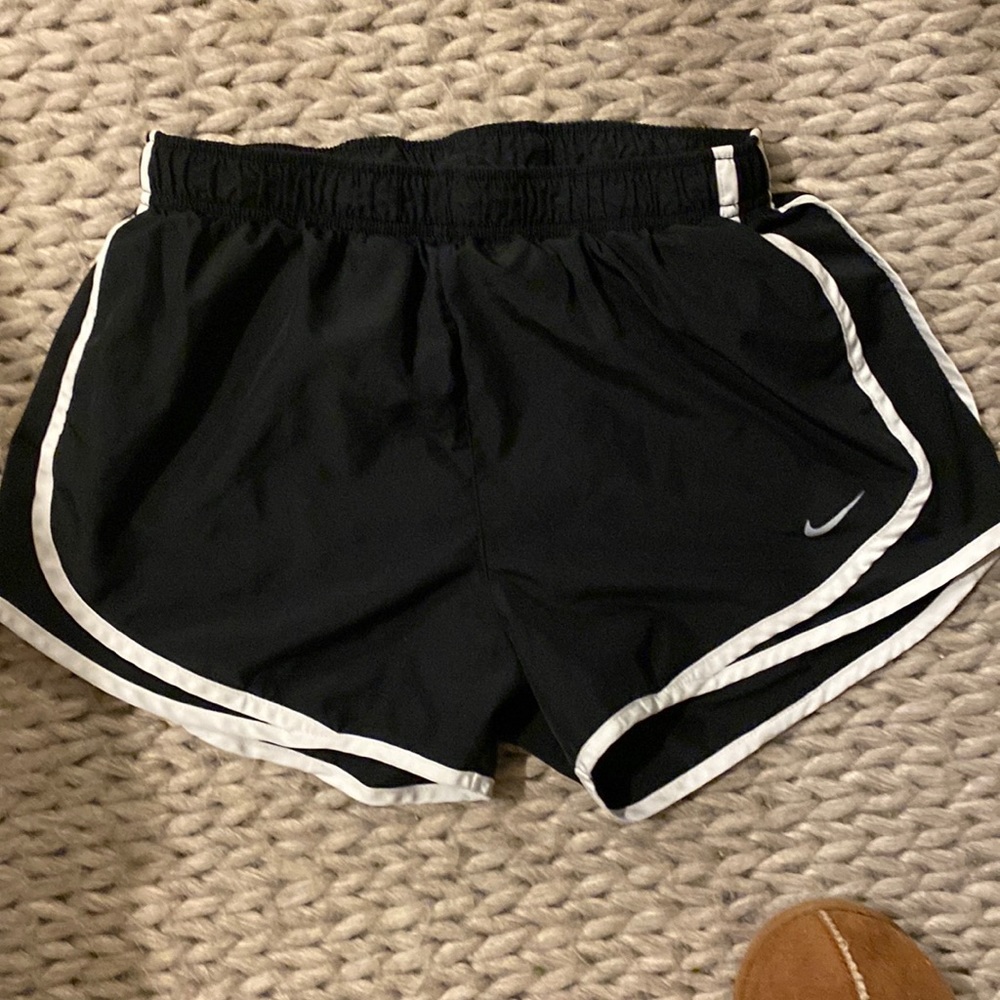 women’s black Nike running shorts.